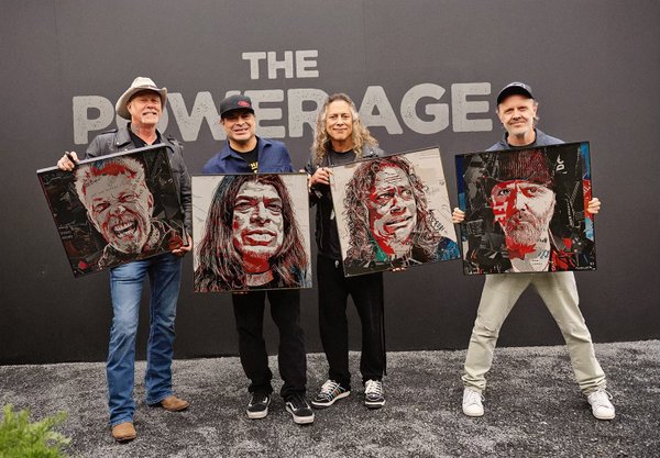 Metallica with their portraits