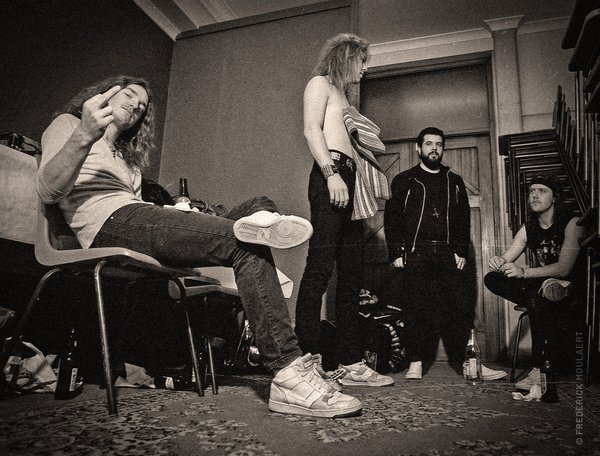 Cliff Burton, James, tour Manager & Lars aftershow in Poperinge, February 1984